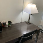 in-room work desk with coffee maker and lamp