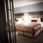 guest suite bedroom with two queen beds
